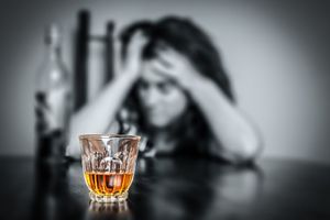 Person struggling with drug addiction seeking recovery support